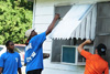Volunteers repaint part of the Ward's home