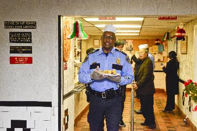 Chief McClelland serving meals